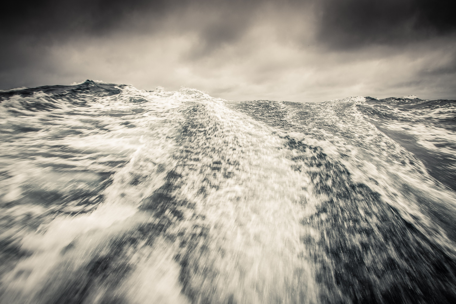 Winds are still in the high 20's and life aboard is proving difficult. Waves making a beautiful backdrop.